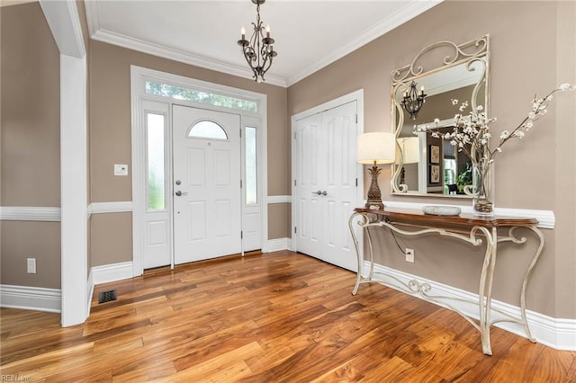1704 Lower Church Ct, Virginia Beach, VA 23455 - foyer with a chandelier, wood finished floors, baseboards, and crown molding