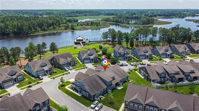 aerial perspective of suburban area featuring a nearby body of water