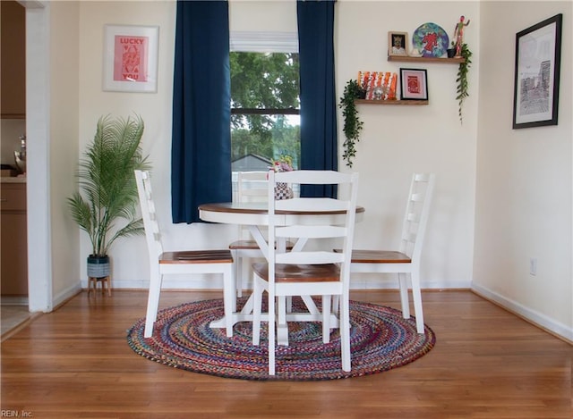 830 Burton St, Hampton, VA 23666 - dining space with wood finished floors and baseboards