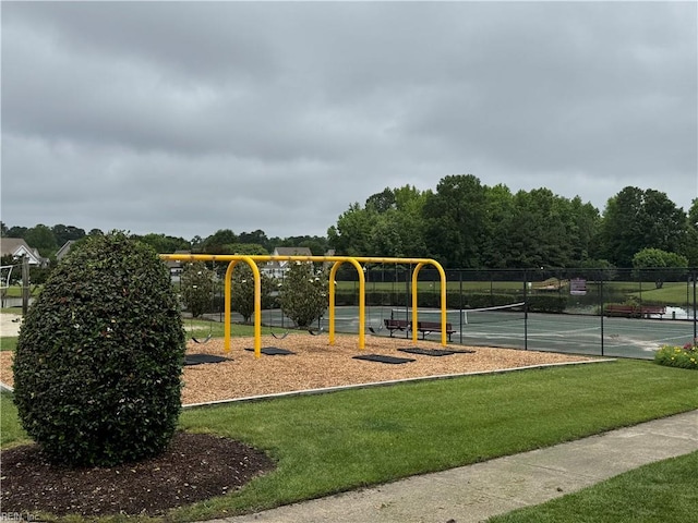communal playground with a tennis court
