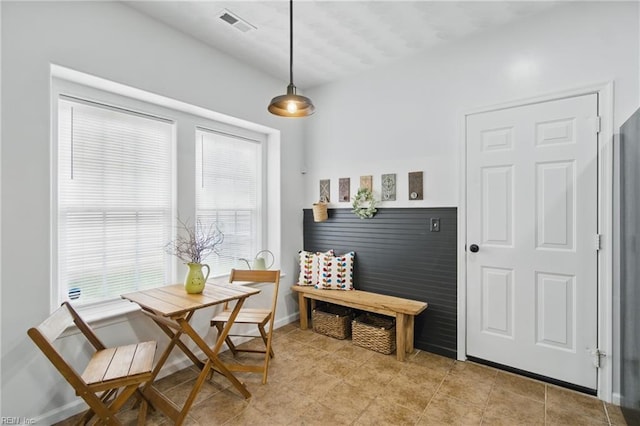 dining room with plenty of natural light and light tile patterned flooring