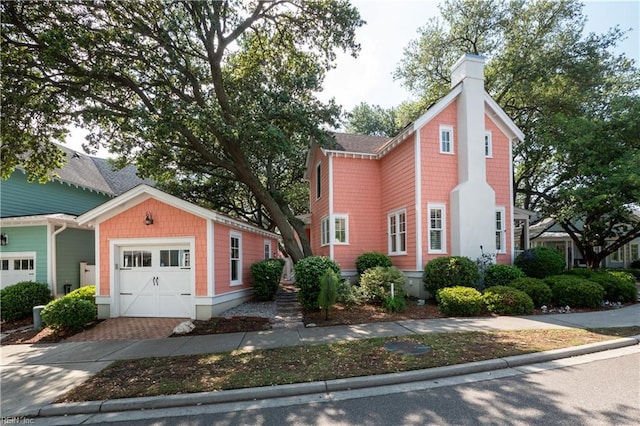 9517 24th Bay St, Norfolk, VA 23518 - view of front of property featuring a chimney, an outdoor structure, driveway, and a garage