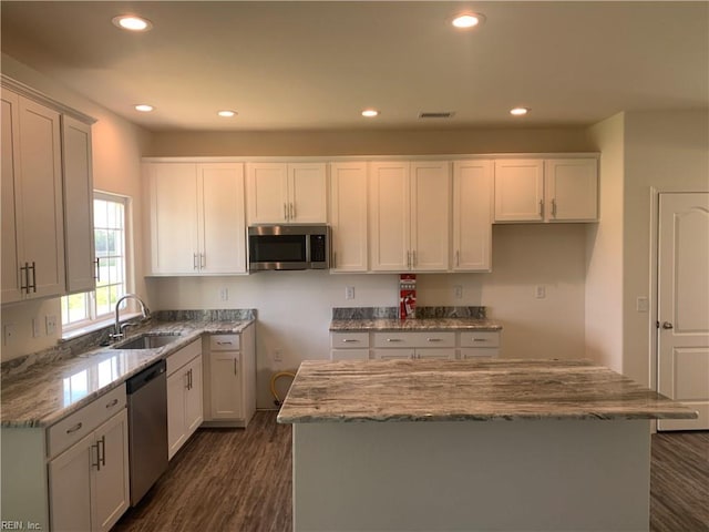 100 Corcoran Ln, Suffolk, VA 23434 - kitchen with stainless steel appliances, a sink, dark wood-style flooring, recessed lighting, and light stone counters