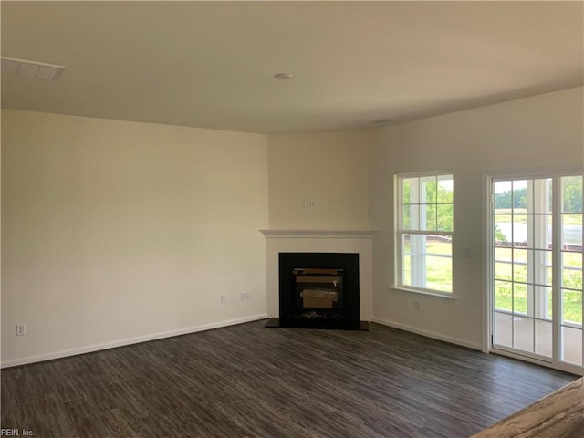 100 Corcoran Ln, Suffolk, VA 23434 - unfurnished living room featuring dark wood-style floors, baseboards, and a fireplace with flush hearth