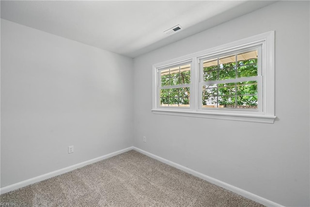 12 Carriage Ln, Newport News, VA 23606 - carpeted empty room with baseboards