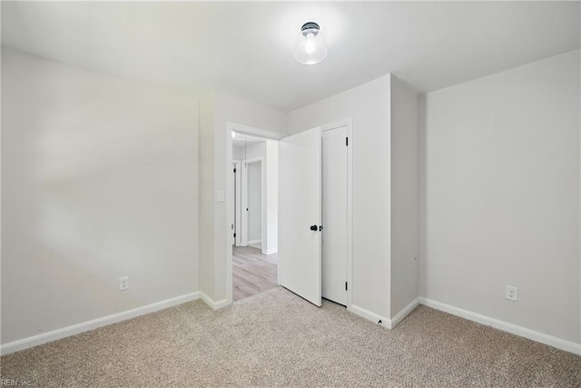 12 Carriage Ln, Newport News, VA 23606 - unfurnished bedroom with light carpet, baseboards, and a closet