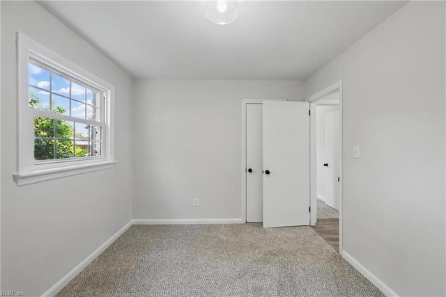 12 Carriage Ln, Newport News, VA 23606 - unfurnished bedroom with carpet, baseboards, and a closet