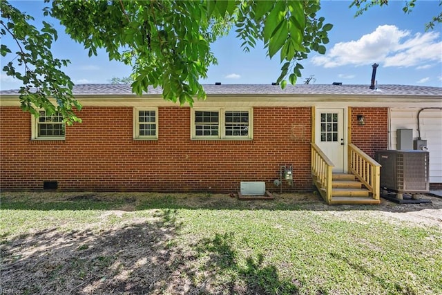 12 Carriage Ln, Newport News, VA 23606 - rear view of house with entry steps, central air condition unit, a yard, and brick siding