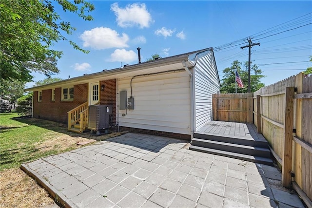 12 Carriage Ln, Newport News, VA 23606 - rear view of property featuring central AC unit, fence, a patio, and a wooden deck