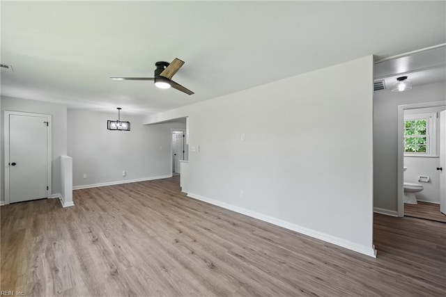 12 Carriage Ln, Newport News, VA 23606 - unfurnished living room with wood finished floors, a ceiling fan, and baseboards