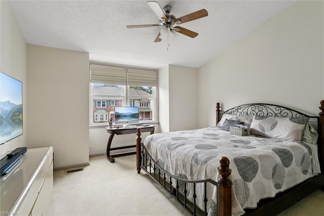 114 Gnarled Oak Ln, Yorktown, VA 23692 - carpeted bedroom featuring a textured ceiling, a ceiling fan, and baseboards