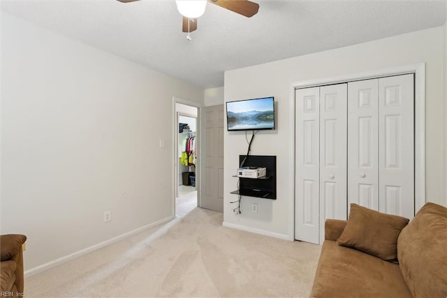 114 Gnarled Oak Ln, Yorktown, VA 23692 - living area with light carpet, baseboards, a ceiling fan, and a textured ceiling