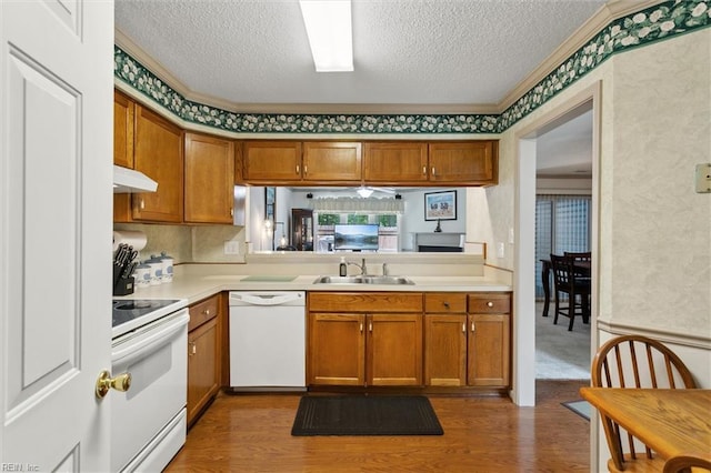 114 Gnarled Oak Ln, Yorktown, VA 23692 - kitchen with white appliances, under cabinet range hood, a textured ceiling, a sink, and light countertops