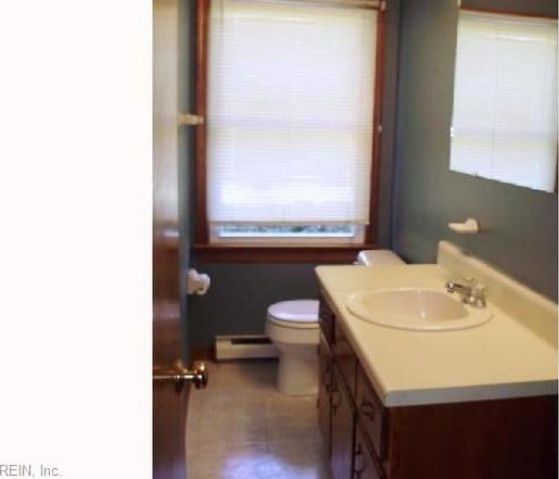 5251 W Run Rd, Charles City, VA 23030 - half bath featuring baseboard heating, toilet, plenty of natural light, and vanity