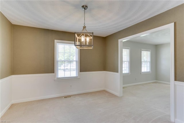 2509 Quail Ridge Ct, Chesapeake, VA 23321 - spare room with a chandelier, light carpet, and baseboards