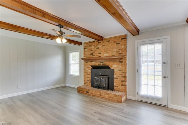 2509 Quail Ridge Ct, Chesapeake, VA 23321 - unfurnished living room featuring a wood stove, wood finished floors, beamed ceiling, ceiling fan, and baseboards