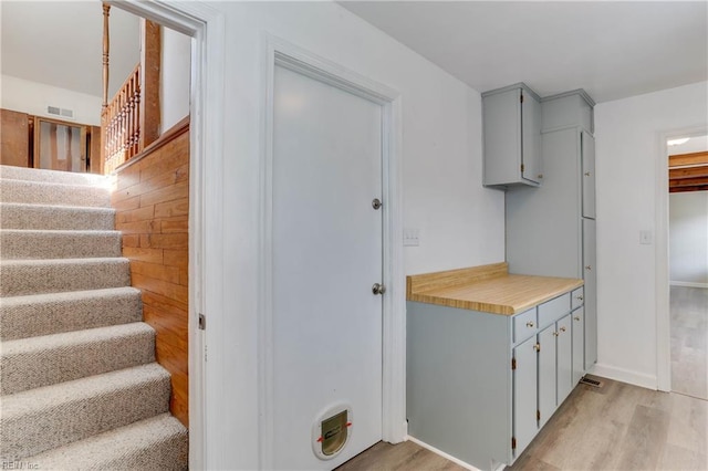 2509 Quail Ridge Ct, Chesapeake, VA 23321 - kitchen featuring gray cabinetry, light wood-type flooring, light countertops, and baseboards