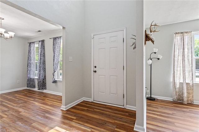 32473 Pebble Brook Dr, Franklin, VA 23851 - foyer entrance with wood finished floors, a chandelier, and baseboards