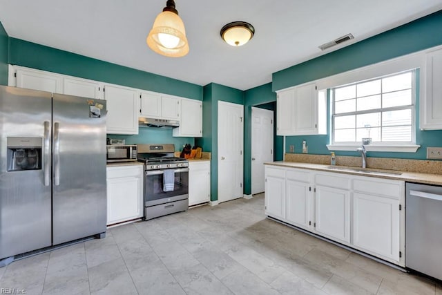 1909 Falling Sun Cir, Virginia Beach, VA 23454 - kitchen featuring stainless steel appliances, a sink, under cabinet range hood, and white cabinets
