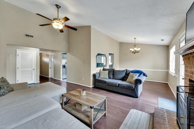 1909 Falling Sun Cir, Virginia Beach, VA 23454 - living room with a chandelier, a brick fireplace, wood finished floors, ceiling fan, and baseboards