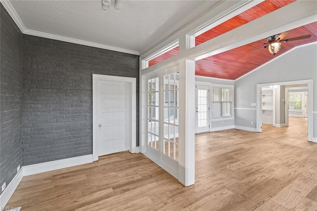 8575 Chesapeake Blvd, Norfolk, VA 23503 - spare room with vaulted ceiling, wood finished floors, baseboards, crown molding, and brick wall