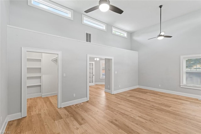 8575 Chesapeake Blvd, Norfolk, VA 23503 - empty room with a ceiling fan, a high ceiling, light wood-style flooring, and baseboards