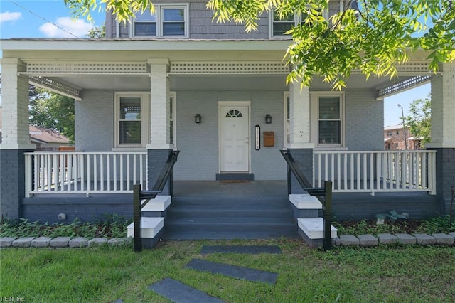 8575 Chesapeake Blvd, Norfolk, VA 23503 - view of front of house featuring covered porch and brick siding