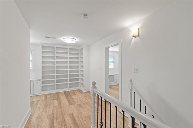 8575 Chesapeake Blvd, Norfolk, VA 23503 - hallway with an upstairs landing, wood finished floors, built in features, and baseboards
