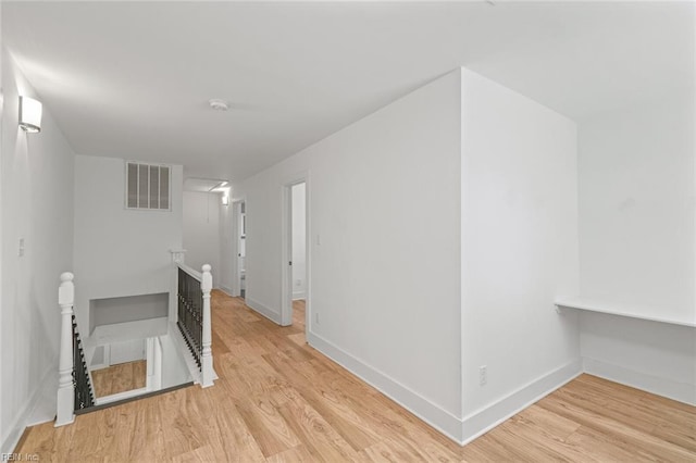 8575 Chesapeake Blvd, Norfolk, VA 23503 - hallway featuring an upstairs landing, light wood-type flooring, and baseboards