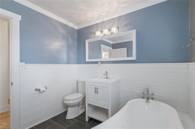 8575 Chesapeake Blvd, Norfolk, VA 23503 - full bath with a wainscoted wall, a freestanding bath, toilet, vanity, and wood finished floors