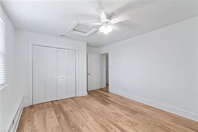 8575 Chesapeake Blvd, Norfolk, VA 23503 - unfurnished bedroom with light wood-style flooring, a closet, baseboards, and multiple windows