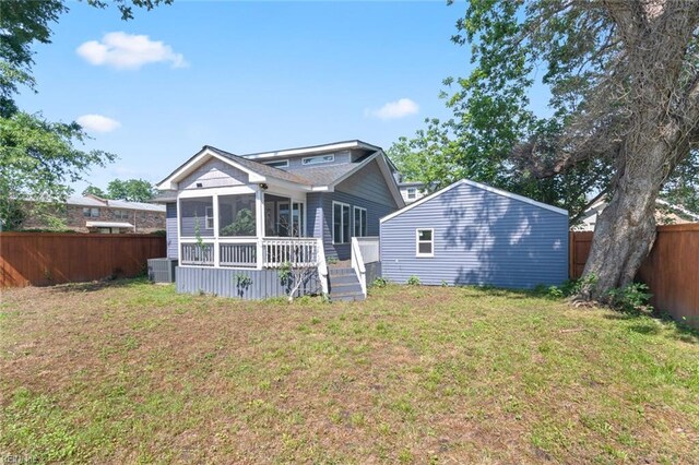 8575 Chesapeake Blvd, Norfolk, VA 23503 - rear view of property with a sunroom, central AC unit, and an outdoor structure