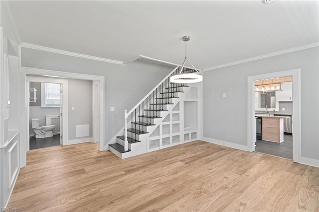 8575 Chesapeake Blvd, Norfolk, VA 23503 - unfurnished living room featuring stairs, ornamental molding, light wood-type flooring, a sink, and baseboards