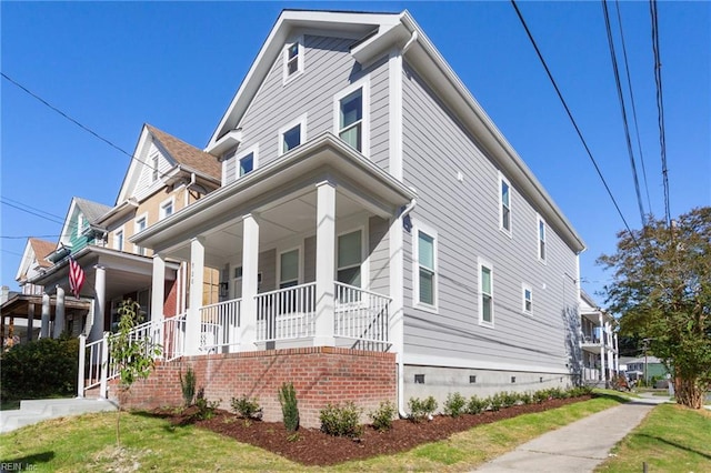 view of front of house featuring crawl space and a porch