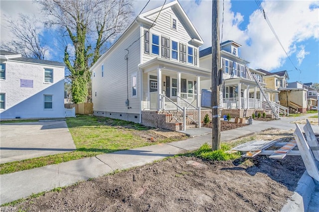 736 A Ave, Norfolk, VA 23504 - view of front of home with covered porch, crawl space, a residential view, and a front lawn