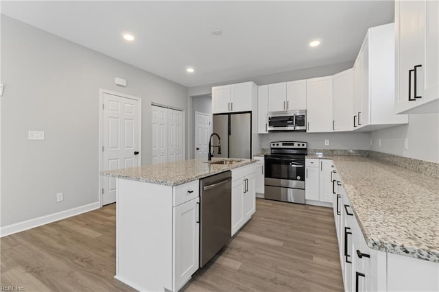 736 A Ave, Norfolk, VA 23504 - kitchen with stainless steel appliances, a sink, a kitchen island with sink, white cabinets, and recessed lighting