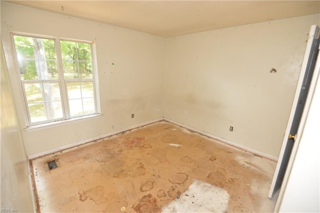unfurnished room featuring plenty of natural light