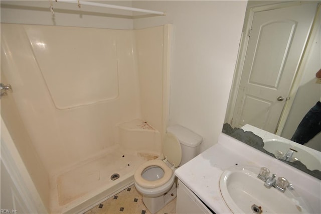 full bath featuring a shower, toilet, and vanity