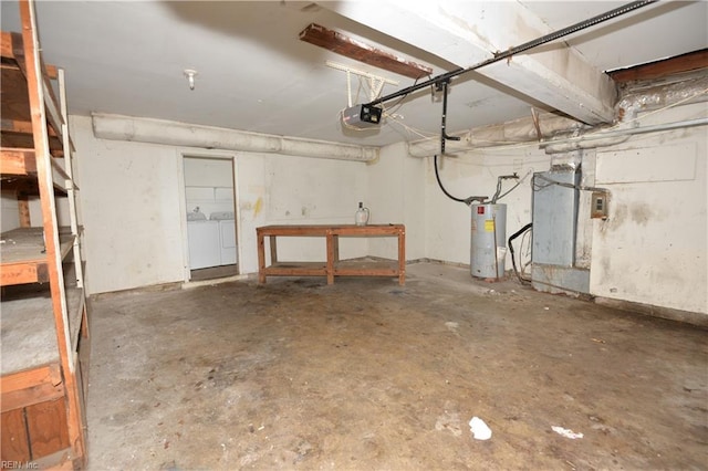 garage with water heater, a garage door opener, and washer and dryer