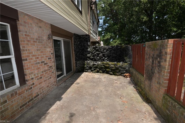 view of patio / terrace featuring fence