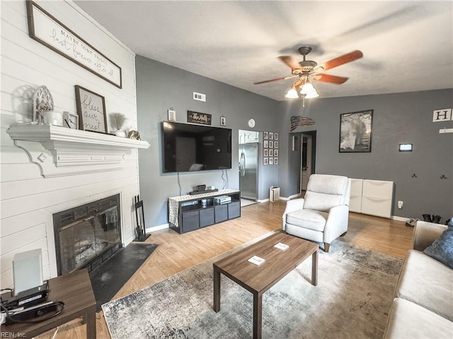103 Lake St, Chesapeake, VA 23323 - living room with a ceiling fan, wood finished floors, baseboards, and a fireplace