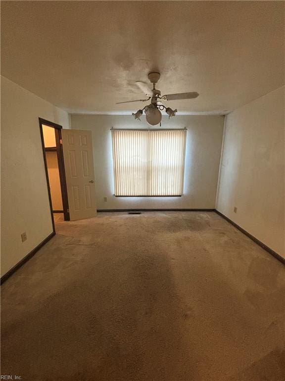 5637 Picadilly Ln, Portsmouth, VA 23703 - carpeted spare room featuring baseboards and a ceiling fan
