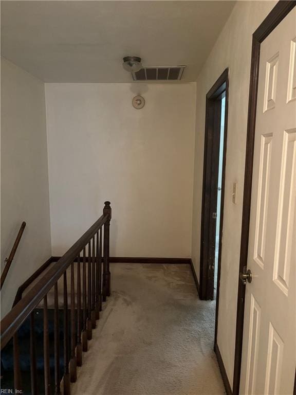 5637 Picadilly Ln, Portsmouth, VA 23703 - hall with an upstairs landing, light colored carpet, and baseboards