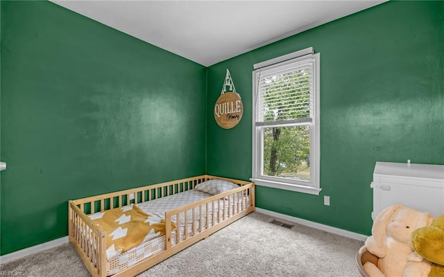 bedroom with carpet and baseboards