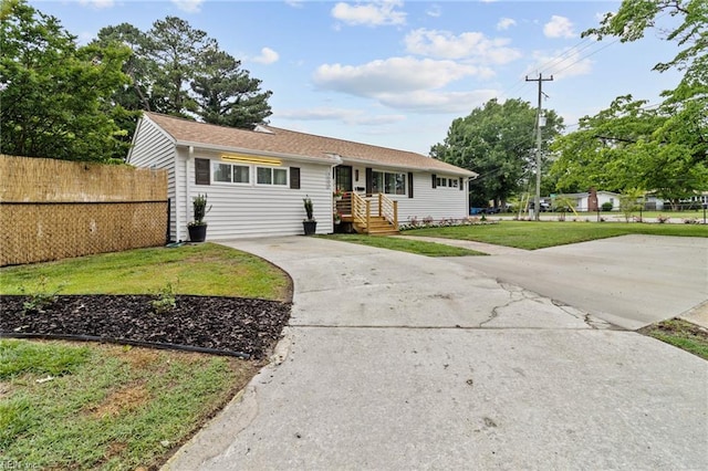 view of front of home featuring concrete driveway