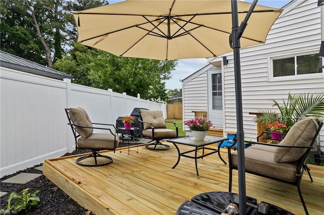 wooden deck featuring fence