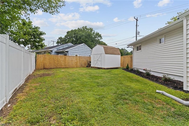 view of yard with an outdoor structure and a storage shed