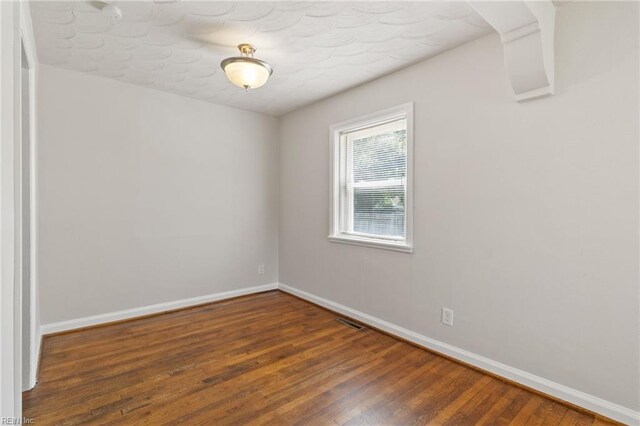 7716 Newport Ave, Norfolk, VA 23505 - empty room with baseboards and wood finished floors
