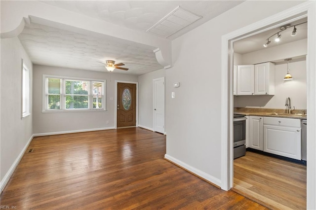 7716 Newport Ave, Norfolk, VA 23505 - foyer entrance with dark wood-style floors, baseboards, and a ceiling fan