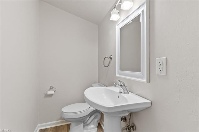 7716 Newport Ave, Norfolk, VA 23505 - bathroom featuring toilet, wood finished floors, and baseboards
